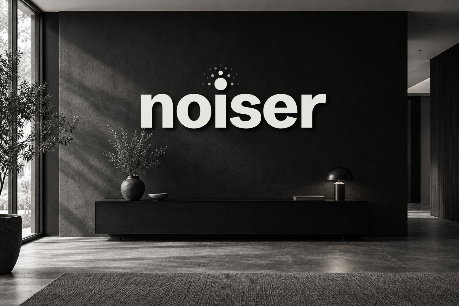 Noiser wordmark on a studio wall